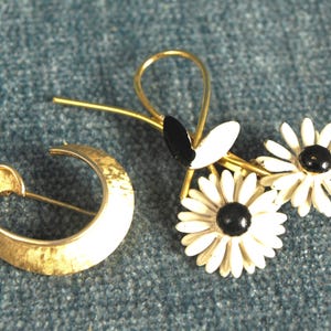 Vintage Costume Jewelry Brooches - Trifari Goldtone Brooch and White and Black Floral / Flower Brooch