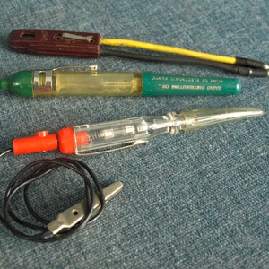 Vintage Oil Mate Pen by Radio Distributing Co and Eagle 90-600v A.C. - D.C & 6-12v Hong Kong Electric Volt Current Testers