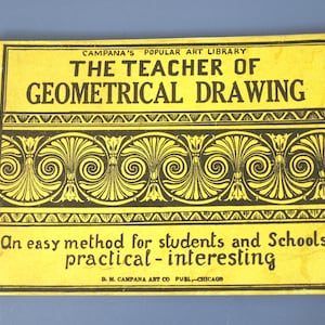 May include: A yellow rectangular book cover titled The Teacher of Geometrical Drawing from Campana's Popular Art Library. It features a black decorative scroll pattern and the text An easy method for students and Schools practical - interesting.