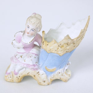 Antique Porcelain Bisque Figurine of a Woman with Fan at Bouquet Vase - Unfinished Back - Circa Late 1800's - Likely from Germany