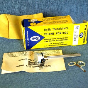 May include: Vintage radio volume control component with original packaging. The yellow and blue box reads "Radio Technician's Volume Control" and includes a compact size. The set includes the control, shaft, and hardware.