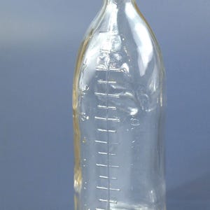 Vintage 8 ounce / oz Clear Glass Baby Milk Bottle with Embossed Infant and Measured Lines