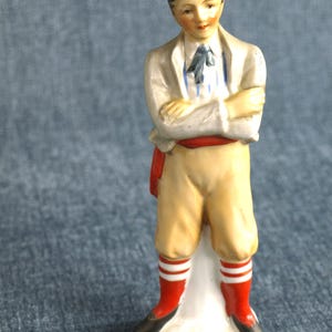 Vintage Young Man / Boy Japan No. 29 Porcelain Figurine - Wearing Red Sash and Red and White Stockings