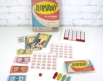 Vintage 1964 Jeopardy Game by Milton Bradley | Missing some Value Tiles; Includes Questions, Snappers, Dice piece and all other parts | Good