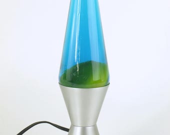 Lampe à lave vintage, 34 cm de haut avec base en argent et cire jaune dans un liquide bleu | Très bon état de fonctionnement