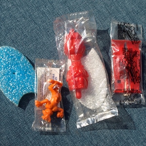 Vintage 80&#39;s Cereal Prize Toys - Captain / Cap&#39;n Crunch Surfer, Post Golden Crisp Tiger, and Snap Together Trumpet