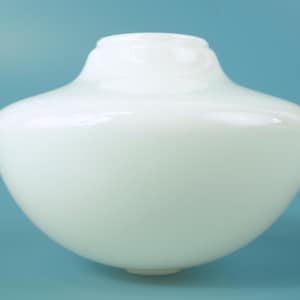 May include: A smooth, opaque white glass light shade with a rounded, bulbous body and a narrower, circular opening at the top. The surface of the glass is glossy and reflects light, creating a clean, uniform appearance for a lighting fixture.