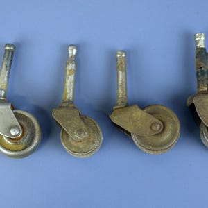 Vintage Metal Caster Wheels with Stems lot of 4 in Various Sizes for Furniture Restoration Parts in Good Aged Condition