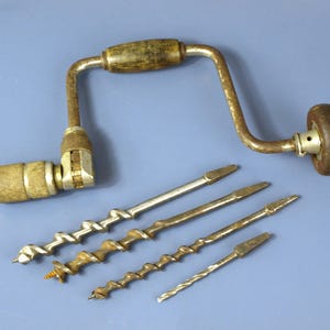 May include: A set of three ceramic mugs with a speckled, matte finish. The mugs are in shades of cream, light gray, and dark gray. Each mug has a simple, minimalist design, perfect for coffee or tea.