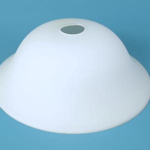 May include: A dome-shaped white glass lamp shade with a smooth, matte finish. The shade features a circular opening at the top center for a light fixture attachment, with a wide, flared rim at the base, creating a classic, clean, and simple profile.
