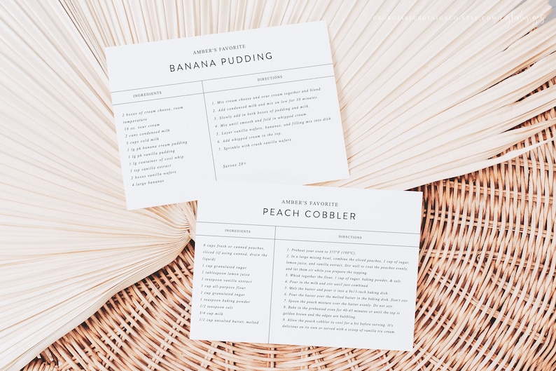 May include: Two recipe cards with handwritten instructions for Amber's favorite Banana Pudding and Peach Cobbler. The cards are on a woven background.