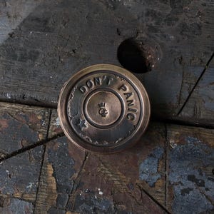 Sunset bronze edc challenge coin. Don't Panic