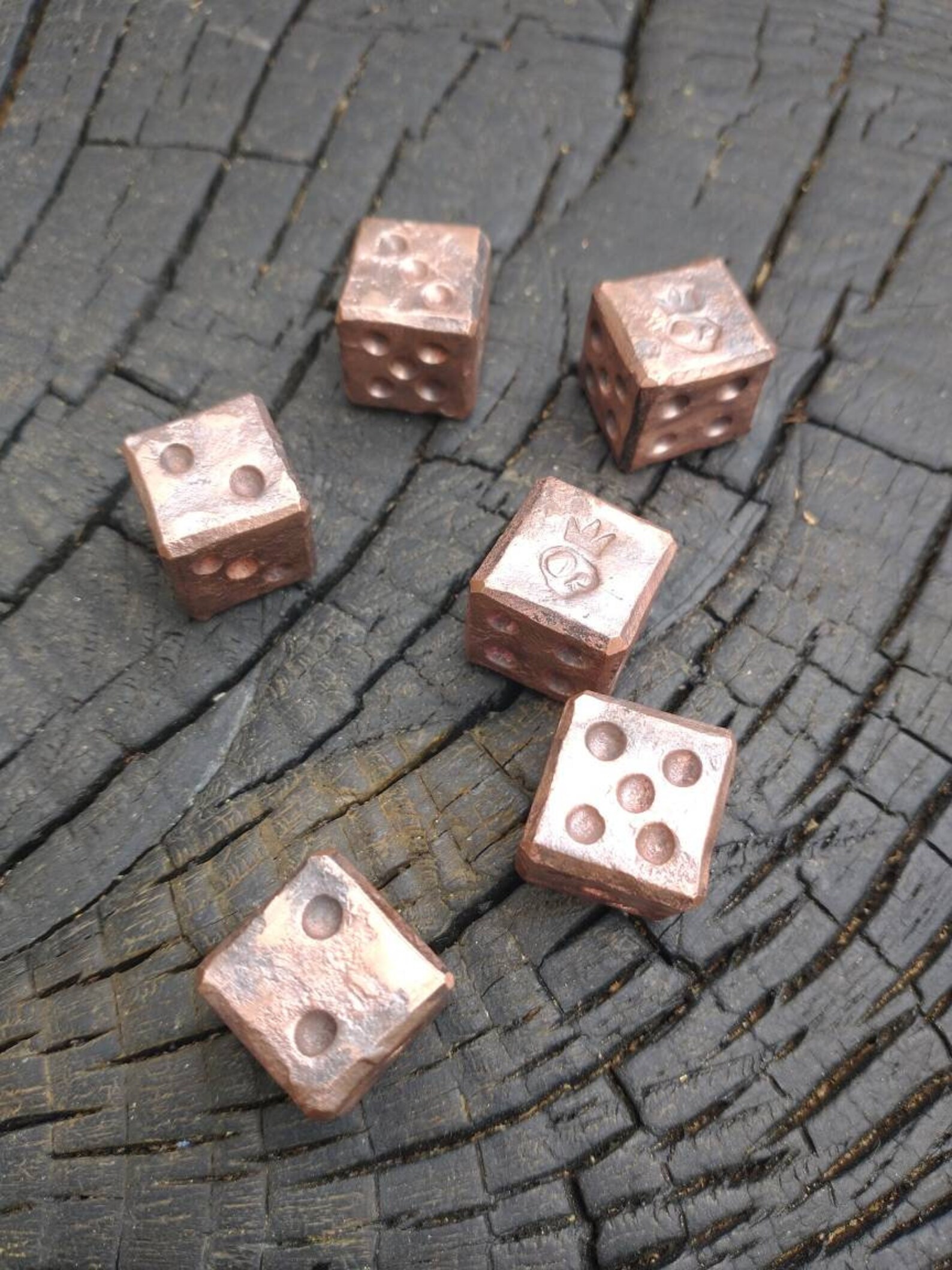 A pair of recycled copper dice. Handmade by Simply Etsy