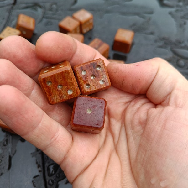 A pair of hand carved vintage micarta dice