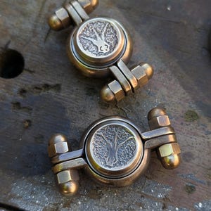 Brass hobo fidget spinner. Never Alone