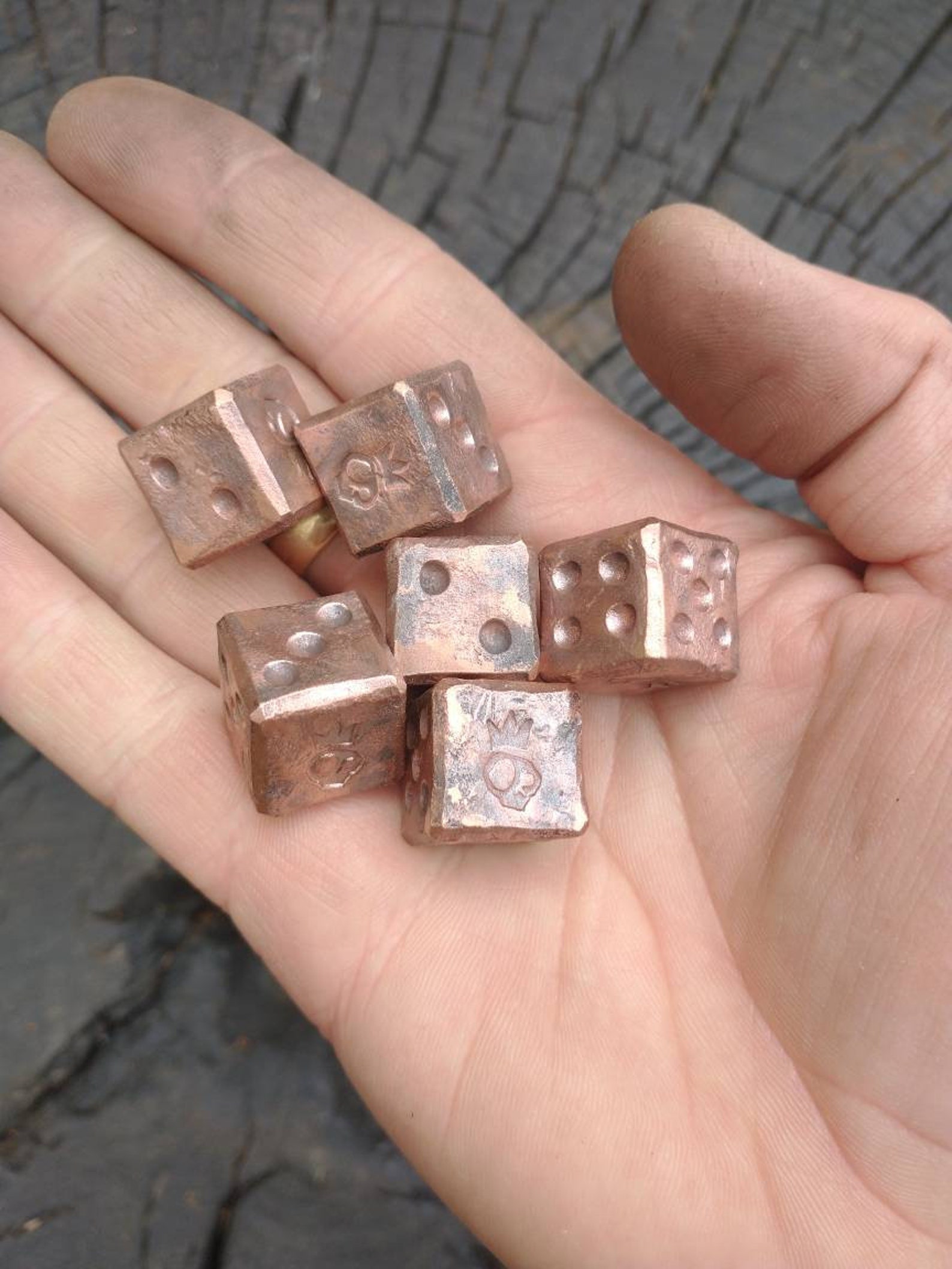 A pair of recycled copper dice. Handmade by Simply Etsy