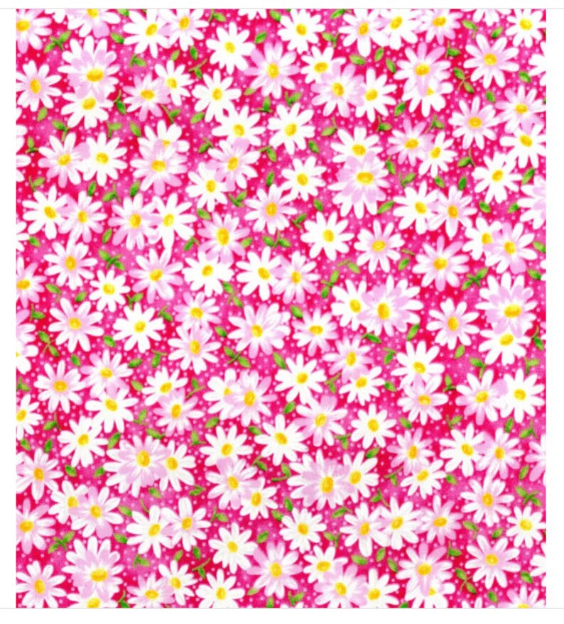 May include: A pink fabric with a white daisy pattern. The daisies have yellow centers and green leaves. The background is a solid pink with white polka dots.