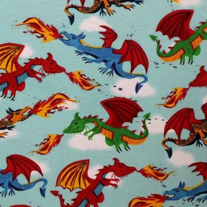 May include: A blue background with a repeating pattern of colorful dragons breathing fire. The dragons are red, green, blue, and yellow.