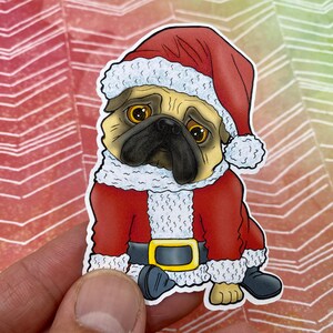 May include: A cartoon pug wearing a red Santa suit with a white fur trim and a red Santa hat with a white fur trim. The pug has a sad expression on its face.