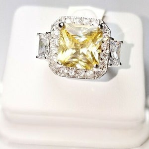 6CTW Cushion Cut Yellow Canary CZ & Clear Pave + Emerald CZ Halo Ring