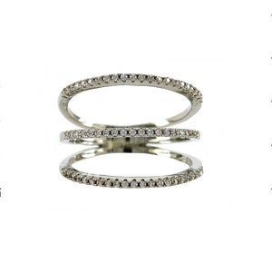 May include: A silver ring with three bands of small clear stones.
