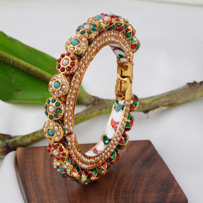 Buy thisIndian bangle crafted with 14k yellow gold electromagnetic plating and tarnish resistant