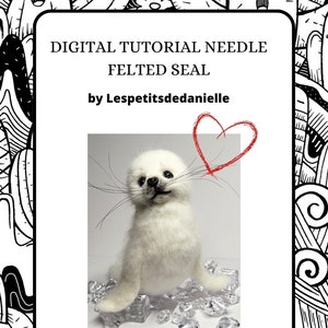 Może przedstawiać: Cyfrowy samouczek do filcowania igłowego białej foki. Samouczek jest w formacie PDF i pochodzi od Lespetitsdedanielle. Obraz przedstawia białą fokę siedzącą na łóżku z kryształków lodu. Czerwone serce jest narysowane w prawym górnym rogu obrazu.