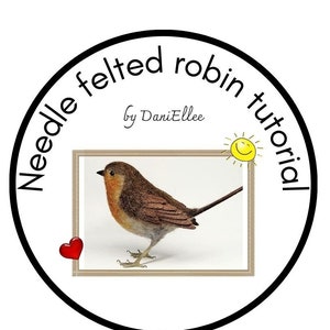 May include: An image for a needle felted robin tutorial. The image shows a felted bird in a frame, encircled by text and graphics. The text reads "Needle felted robin tutorial by DaniEllee". A red heart and a smiling sun are also included.