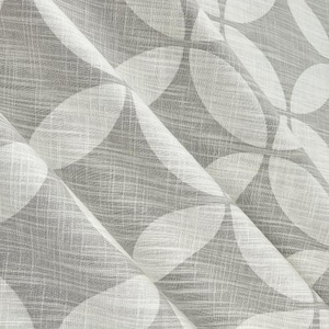 May include: A semi-sheer fabric featuring a repeating geometric pattern of white overlapping circles on a light gray background. The material has a visible woven texture with horizontal and vertical threads, creating a subtle grid effect throughout.