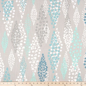 May include: A fabric swatch with a repeating pattern of teardrop shapes filled with white, light blue, and teal dots on a light gray background.