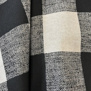 May include: Black and white checkered fabric with a woven texture.