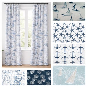 May include: Two white and blue nautical-themed curtain panels hang in front of a window. The curtains feature a map and anchor design. Additional fabric swatches show sailboat, starfish, and anchor patterns, along with coral and map designs.