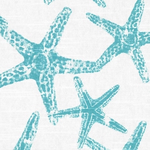 May include: A white fabric featuring a repeating pattern of teal starfish. The starfish have a textured, stamped appearance with visible white gaps within the teal color, creating a distressed look across the surface of the textile material.