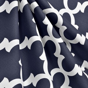 May include: Navy blue fabric with a white geometric pattern. The fabric has a subtle texture and a soft drape.