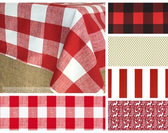 May include: Red and white checkered tablecloth with a burlap backing. The tablecloth is folded in half and the corner is lifted up. The image also shows several other fabric patterns, including red and black checkered, red stripes, and a red and white pattern with a reindeer design.