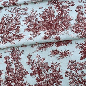 May include: Red toile fabric with a white background featuring a repeating pattern of people, trees, and buildings. The pattern is reminiscent of a French country scene.