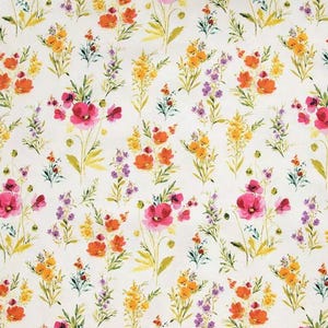 May include: A white fabric featuring a repeating pattern of watercolor-style wildflowers in shades of vibrant pink, orange, yellow, and purple. The botanical design includes various stems, leaves, and blossoms scattered across the surface.