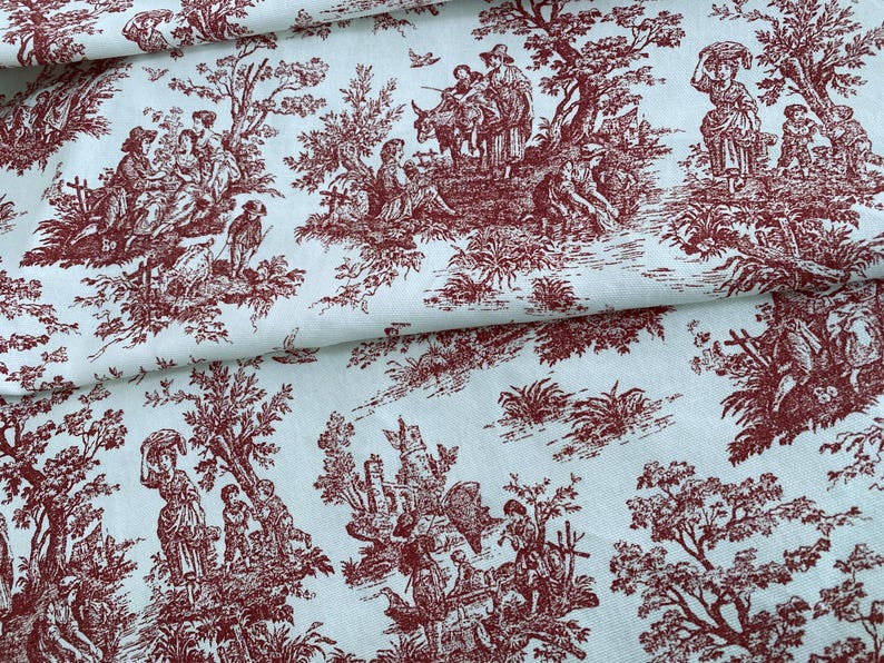 May include: A fabric with a repeating toile de Jouy pattern in burgundy on a light blue background. The design depicts pastoral scenes with figures, trees, and architectural elements, creating a classic, decorative textile.