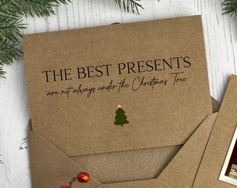 May include: A brown card with the text "THE BEST PRESENTS are not always under the Christmas Tree" and a small green Christmas tree illustration.