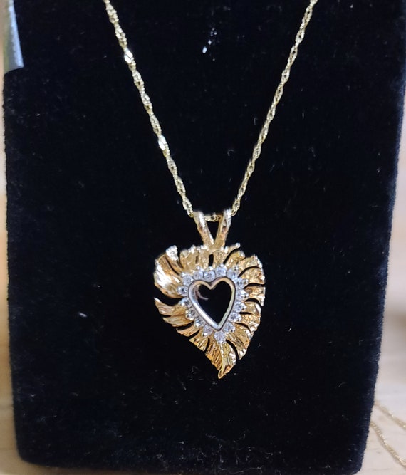 14kt solid gold with diamond pendant and 14kt neck
