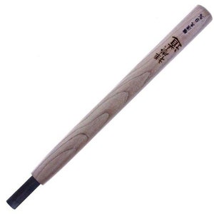 May include: A wooden tool with a black handle and Japanese text that reads "無垢-純-真" and "真宗の木"