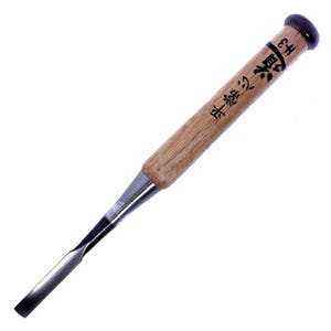 May include: A Japanese chisel with a wooden handle and a metal blade. The handle is inscribed with Japanese characters.