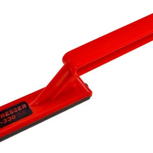 May include: A vibrant red NT Dresser RL-330 tool with a black rectangular pad. The tool features a handle and a rectangular base with the text "NT DRESSER RL-330" printed on it. It is designed for smoothing surfaces.