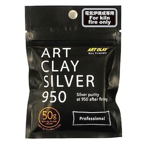 May include: A black bag with a white label that says "ART CLAY SILVER 950" and "Professional". The bag contains 50 grams of silver clay with a 90% silver and 10% copper alloy. The label also says "For kiln fire only" and "Silver purity at 950 after firing".