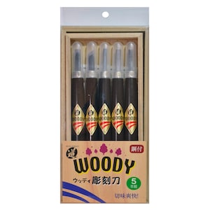 May include: A set of five wooden carving tools in a wooden box. The tools are labelled "WOODY" and have a red and gold design. The box has a label that says "WOODY" and "5 本組" in Japanese.
