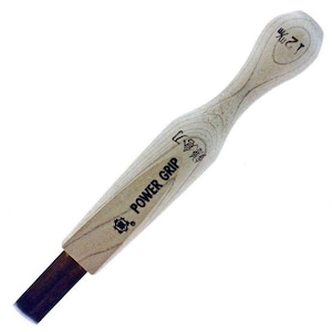 May include: A wooden power grip tool with a black metal blade. The tool is labelled "POWER GRIP" and has a Japanese character on it. The handle is labelled "12" and "木" in Japanese.
