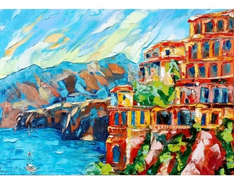 May include: An impressionistic painting of a coastal town with colorful buildings on a cliffside. The artwork features vibrant blues, oranges, and greens, with a sailboat on the turquoise water. Mountains and a bright sky complete the scene.