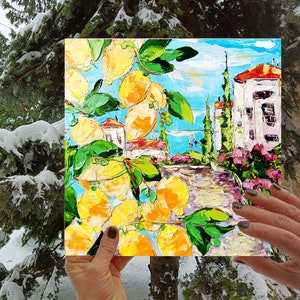 May include: A painting of a lemon tree with yellow lemons and green leaves in front of a white building with a blue sky and pink flowers. The painting is done in a textured style with thick brushstrokes.