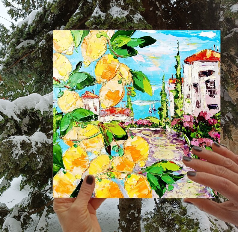 May include: A painting of a lemon tree with yellow lemons and green leaves in front of a white building with a blue sky and pink flowers. The painting is done in a textured style with thick brushstrokes.