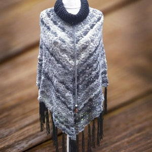 Handmade  crochet ladies poncho. Free size. Vintage 1970&#39;s style poncho  in jewelled greys. Black polo neck and fringe.